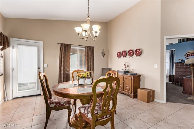 tiled dining space featuring a notable chandelier and vaulted ceiling