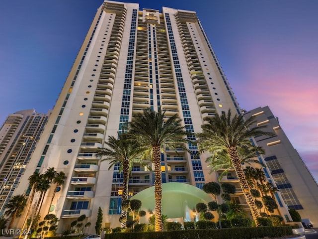 view of outdoor building at dusk