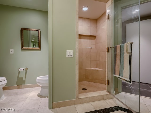 bathroom featuring tile patterned flooring, a bidet, and a shower with shower door