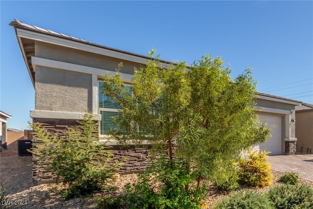 view of property exterior with a garage