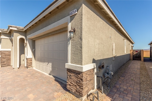 view of property exterior featuring a garage