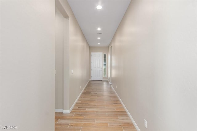 10254 Baronia St, Las Vegas, NV 89141 - corridor with light wood-style flooring, baseboards, and recessed lighting