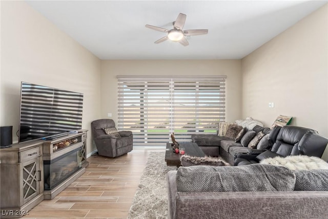 10254 Baronia St, Las Vegas, NV 89141 - living room with light wood-style floors and a ceiling fan