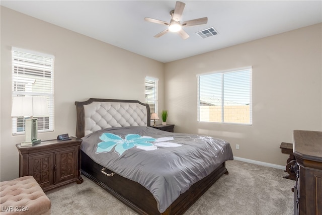 bedroom featuring ceiling fan and light colored carpet