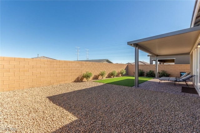 10254 Baronia St, Las Vegas, NV 89141 - fenced backyard featuring a patio