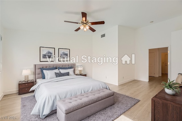 bedroom featuring light hardwood / wood-style floors and ceiling fan