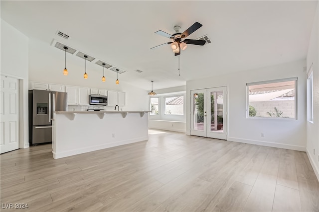 unfurnished living room with french doors, light hardwood / wood-style flooring, and ceiling fan