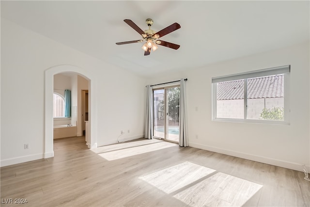 spare room with light hardwood / wood-style floors and ceiling fan