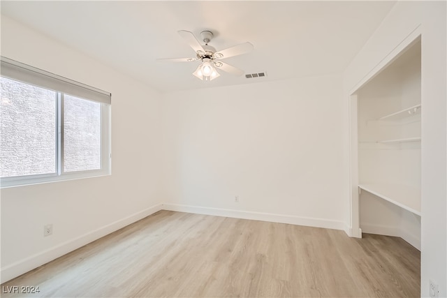 unfurnished room featuring ceiling fan and light hardwood / wood-style floors