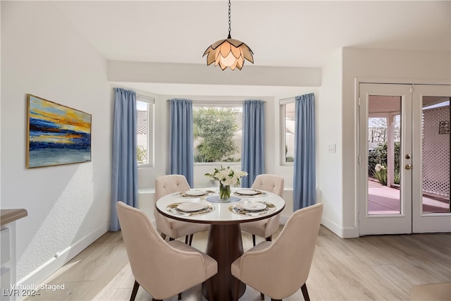 dining room with light wood-type flooring