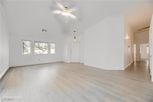 empty room with light wood-type flooring, ceiling fan, and crown molding