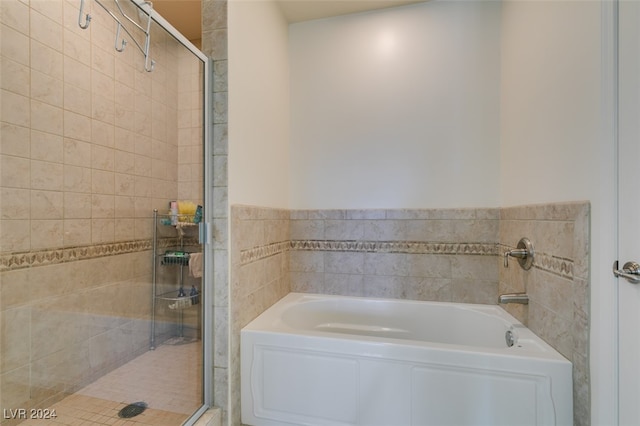 bathroom with independent shower and bath