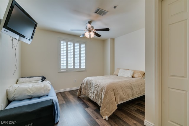 bedroom featuring ceiling fan and dark hardwood / wood-style floors