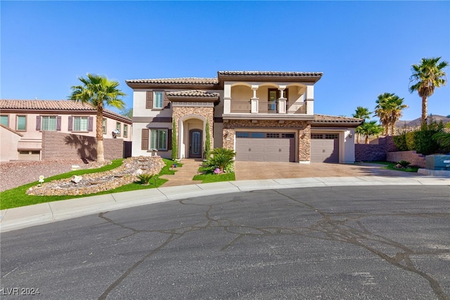 mediterranean / spanish house with a garage