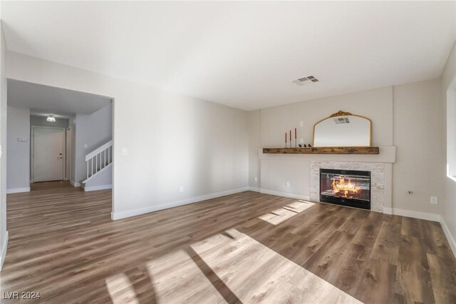 unfurnished living room with hardwood / wood-style floors