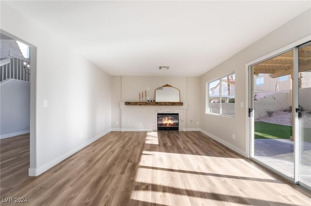 unfurnished living room featuring wood-type flooring