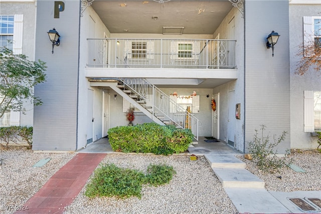 doorway to property featuring a balcony