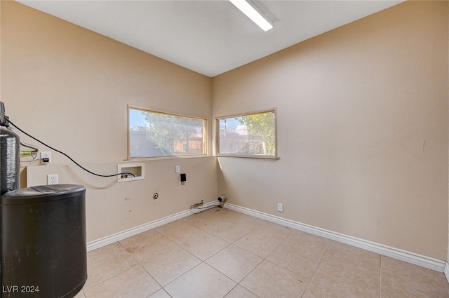 laundry area featuring hookup for an electric dryer, hookup for a gas dryer, light tile patterned flooring, and hookup for a washing machine