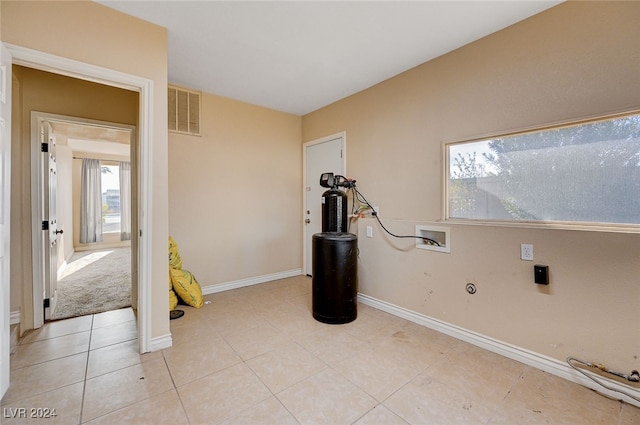 exercise area with light tile patterned floors