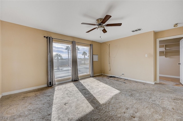 spare room featuring ceiling fan and light colored carpet