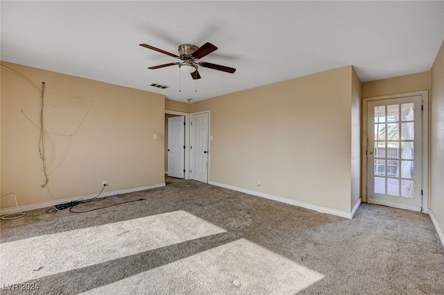 empty room with carpet and ceiling fan