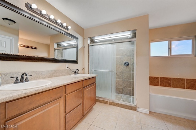 bathroom featuring tile patterned flooring, vanity, and plus walk in shower