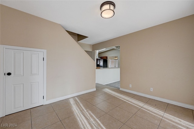 spare room with light tile patterned floors