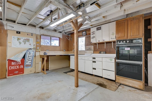 kitchen featuring white cabinetry and double oven