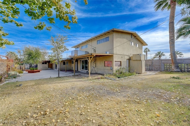 back of house with a patio area