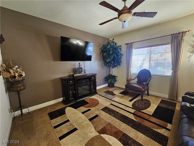 carpeted living room featuring ceiling fan