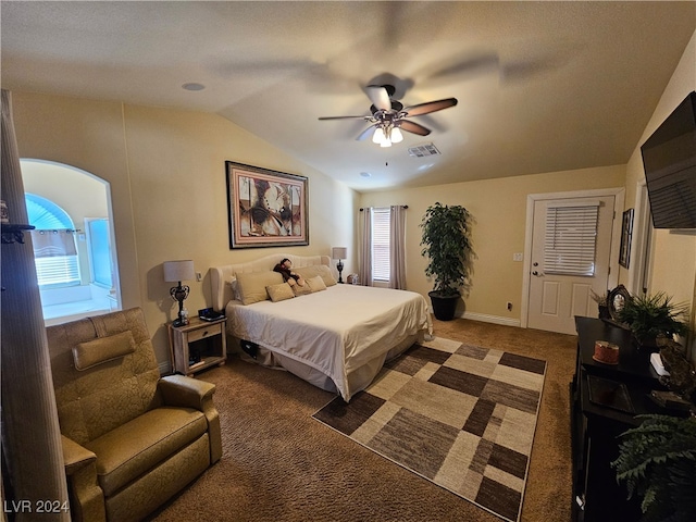 carpeted bedroom with ceiling fan and vaulted ceiling