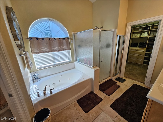 bathroom with vanity, tile patterned flooring, and separate shower and tub