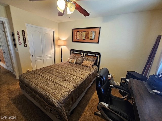 bedroom with a closet, ceiling fan, and dark carpet