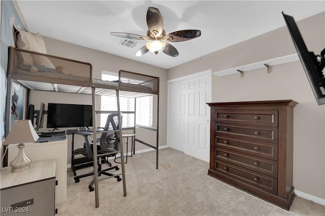 carpeted office featuring ceiling fan