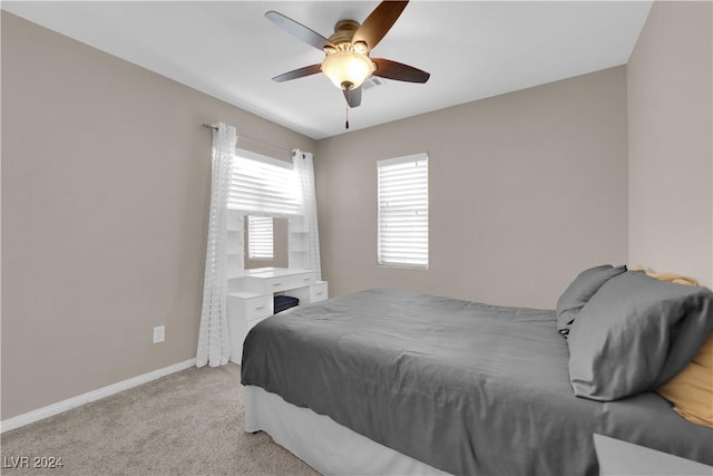 bedroom with light colored carpet and ceiling fan