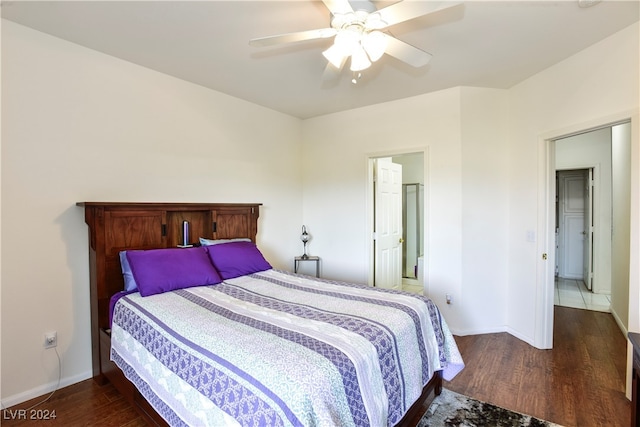 bedroom featuring dark hardwood / wood-style flooring and ceiling fan