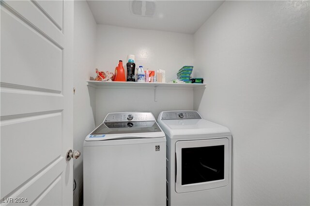 laundry room featuring separate washer and dryer