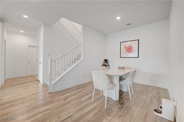 dining area featuring light wood-type flooring