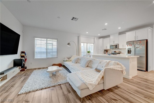 living room featuring light wood-type flooring