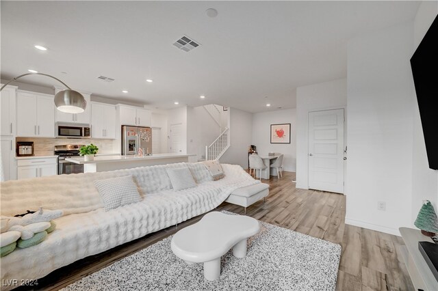 living room featuring light wood-type flooring