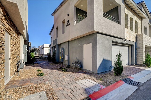 view of side of home with a garage