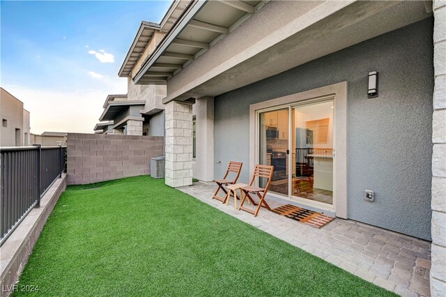 yard at dusk with a patio