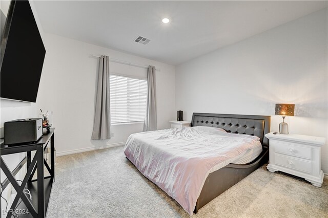 bedroom with light carpet