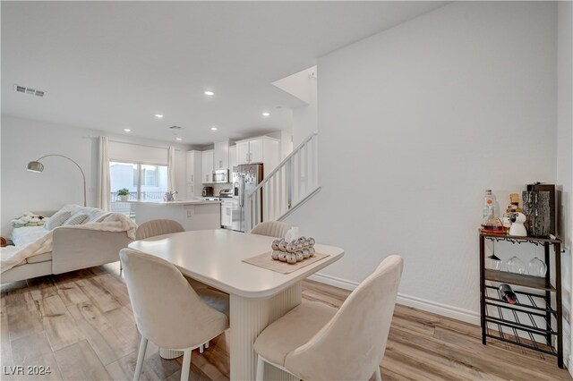 dining room with light hardwood / wood-style floors