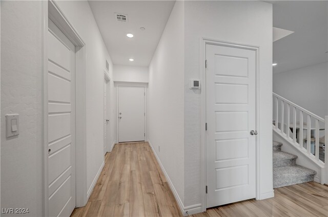 hallway featuring light hardwood / wood-style flooring