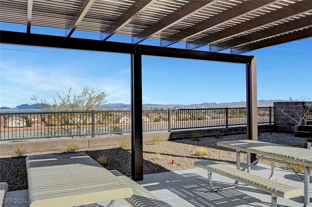 exterior space with a mountain view and a pergola