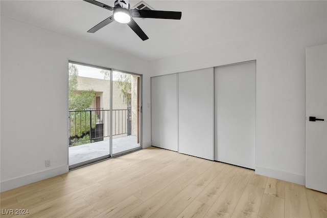 unfurnished bedroom with light hardwood / wood-style floors, ceiling fan, a closet, and access to outside