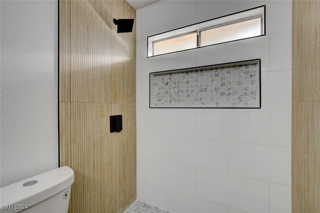 bathroom with toilet and walk in shower