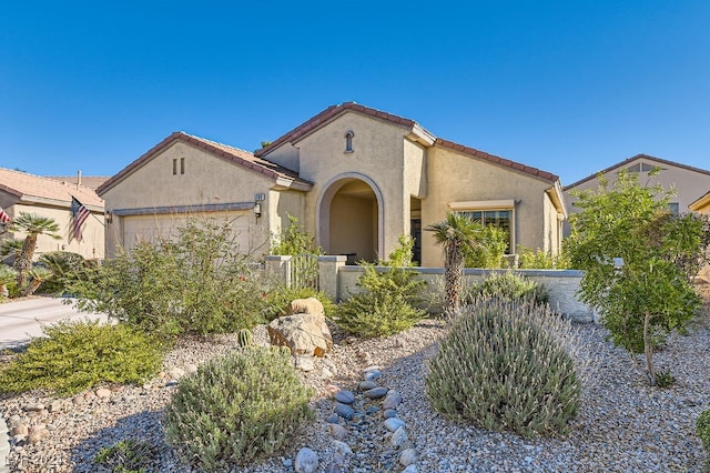 mediterranean / spanish-style home featuring a garage