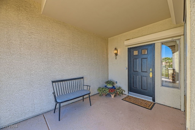 entrance to property featuring a patio